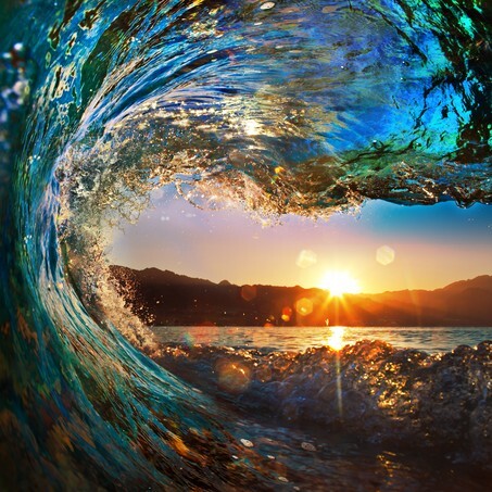 Ocean wave at sunset